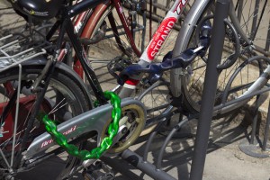 An example of how to lock up a bike well: a chain locks the front wheel and the frame to a fixed point, whilst a second chain locks the rear wheel to the frame.